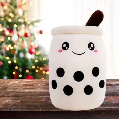 Peluche bubble tea boisson lait frappé à Noël beau sourire sur la table
