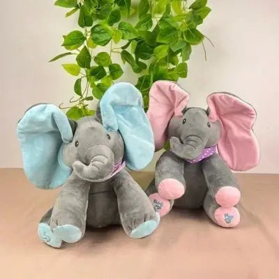 Peluche elephant gris avec magnifiques oreilles dansantes assis au salon