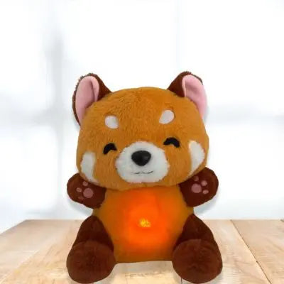 Peluche panda-peluche kawaii roux et doux assis au salon
