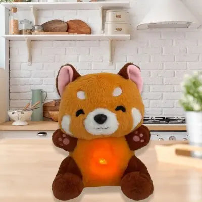 Peluche panda roux le très beau cadeau installé dans la cuisine