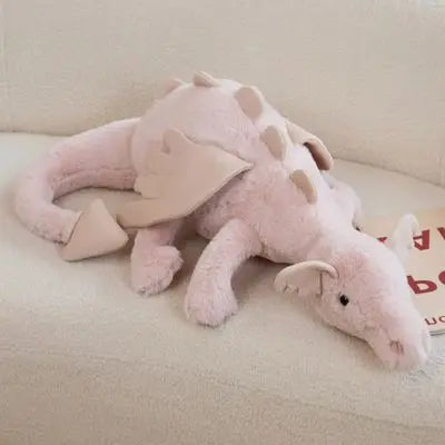 Peluche dragon rose avec des écailles au dos, peluche kawaii yeux noirs très adorable