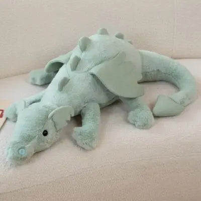 Peluche dragon vert peluche kawaii soyeux aux eux réalistes noirs et gentil