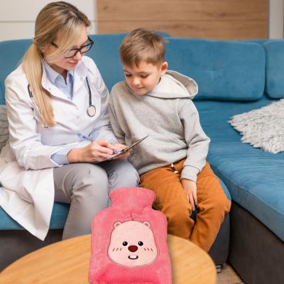 Bouillotte peluche le nounours avec sa chaleur prescrite pour enfant