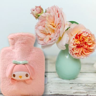 Bouillotte peluche la housse rose chaleureuse et apaisante