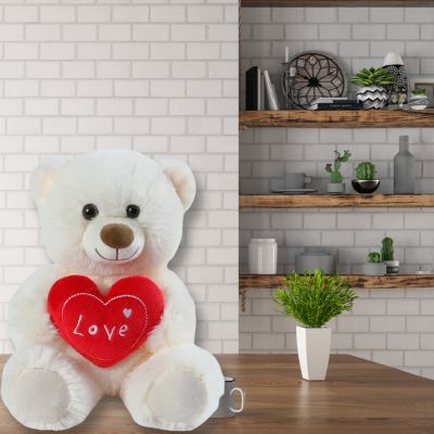 Ours en peluche le nounours blanc assis tranquillement dans la cuisine