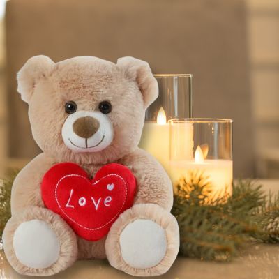 Ours en peluche le Teddy bear beau nounours sous les bougies illuminées