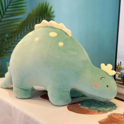 Peluche dinosaure vert meilleure douceur et rêves enfantins à offrir à Noël