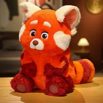 Peluche kawaii l'excellent renard mignon et roux qui est assis à table
