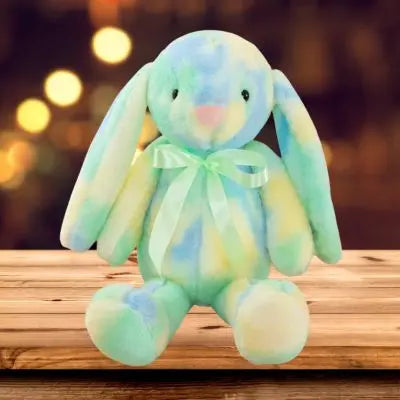 Peluche lapin adorable peluche kawaii douce au ruban satiné de couleur verte assis au pupitre