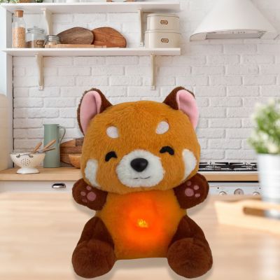 Peluche panda roux le très beau cadeau installé dans la cuisine