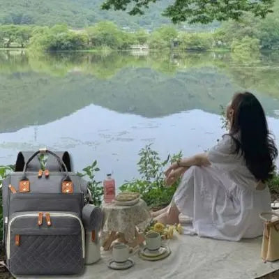 Sac a langer bebe gris-pour-ranger-les-biberons et les collations